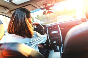 woman driving a car in Florida auto insurance breakdown from Cape Coral injury lawyers
